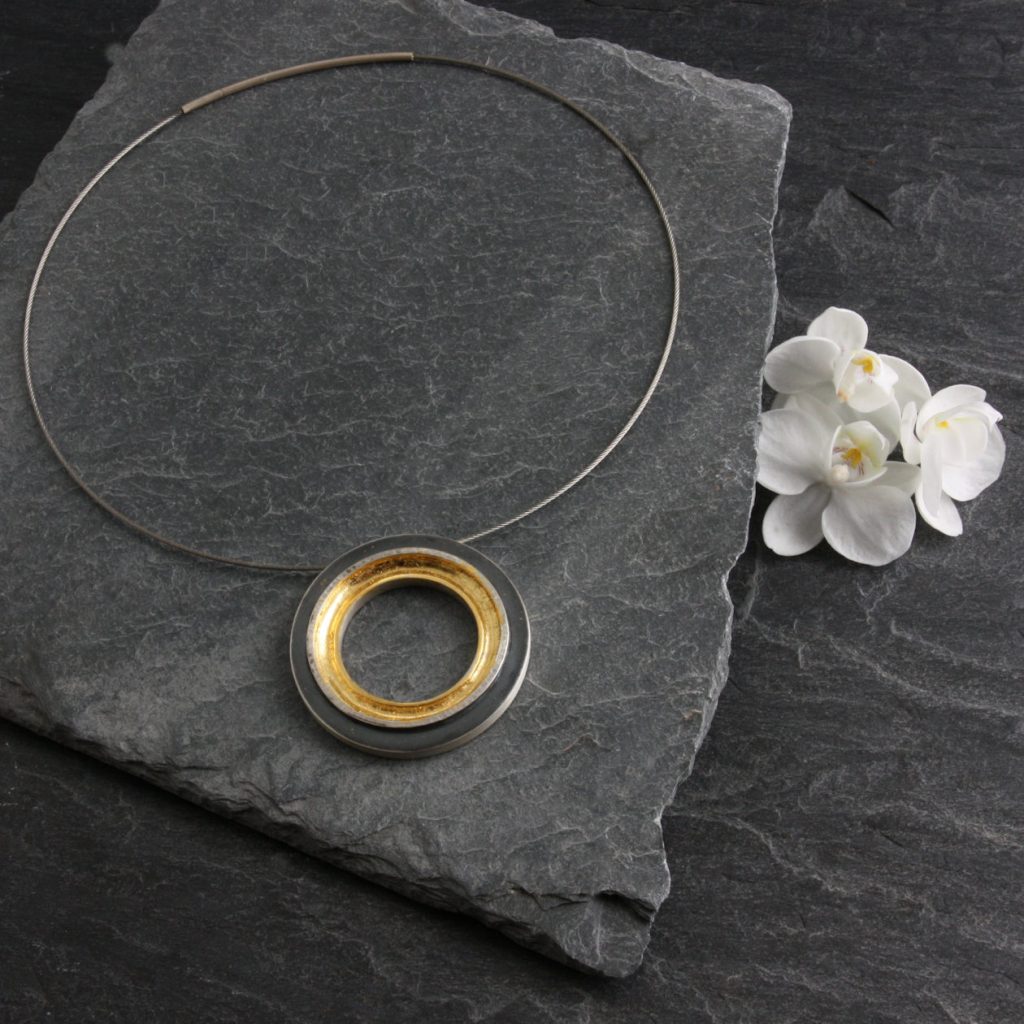 The “Modern Maestro” German–born designer, Agnes Seebass, creates her signature jewelry in silver by combining techniques that include forging, oxidizing, chiseling, texturing, and sanding.